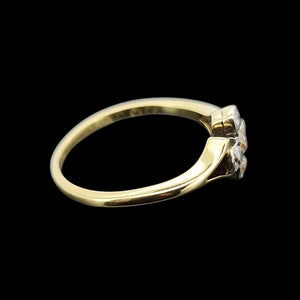 Gold ring with diamonds on a black background