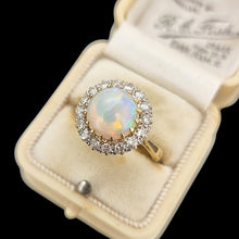 Load image into Gallery viewer, Gold ring with an opal stone and diamonds in an antique ring box
