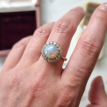 Load image into Gallery viewer, Opal ring with diamond accents modelled on a finger
