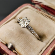 Load image into Gallery viewer, A diamond solitaire ring in platinum, in a ring box
