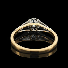 Load image into Gallery viewer, An old cut diamond solitaire ring in gold and platinum, on a black background
