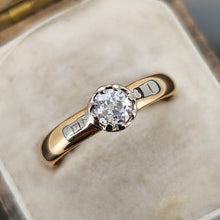 Load image into Gallery viewer, A single stone old cut diamond ring on a yellow gold band with white gold shoulder details, in an antique ring box
