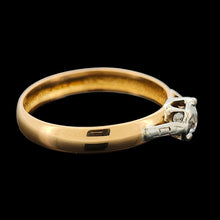 Load image into Gallery viewer, A single stone old cut diamond ring on a yellow gold band with white gold shoulder details
