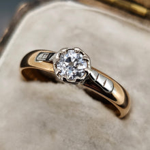 Load image into Gallery viewer, A single stone old cut diamond ring on a yellow gold band with white gold shoulder details, in an antique ring box
