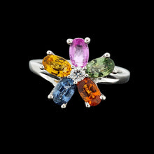 Load image into Gallery viewer, A multi-coloured gemstone flower shaped ring in white gold, on a black background
