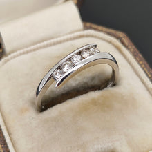 Load image into Gallery viewer, A white gold five stone diamond crossover ring, in an antique ring box
