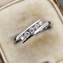 Load image into Gallery viewer, A white gold five stone diamond crossover ring, in an antique ring box
