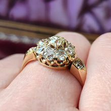 Load image into Gallery viewer, An old cut diamond cluster ring in yellow gold, modelled on a hand

