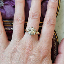 Load image into Gallery viewer, An old cut diamond cluster ring in yellow gold, modelled on a hand
