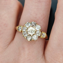 Load image into Gallery viewer, An old cut diamond cluster ring in yellow gold, modelled on a hand
