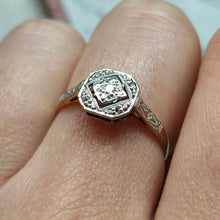 Load image into Gallery viewer, An octagonal shaped diamond ring in yellow gold and platinum, modelled on a hand
