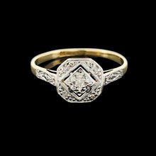 Load image into Gallery viewer, An octagonal shaped diamond ring in yellow gold and platinum, on a black background
