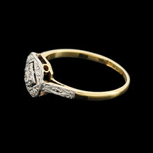 Load image into Gallery viewer, An octagonal shaped diamond ring in yellow gold and platinum, on a black background
