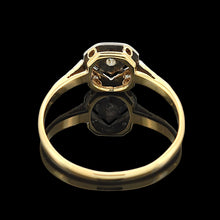 Load image into Gallery viewer, An octagonal shaped diamond ring in yellow gold and platinum, on a black background
