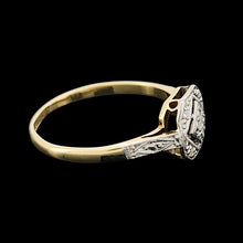 Load image into Gallery viewer, An octagonal shaped diamond ring in yellow gold and platinum, on a black background
