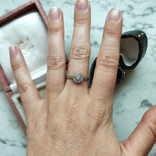 Load image into Gallery viewer, An octagonal shaped diamond ring in yellow gold and platinum, modelled on a hand
