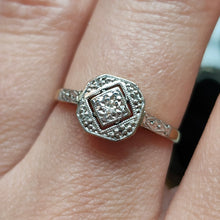 Load image into Gallery viewer, An octagonal shaped diamond ring in yellow gold and platinum, modelled on a hand
