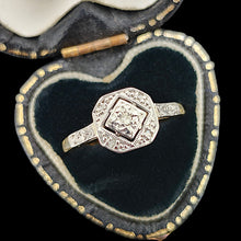 Load image into Gallery viewer, An octagonal shaped diamond ring in yellow gold and platinum, in a heart-shaped ring box
