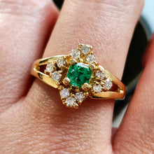Load image into Gallery viewer, An emerald and diamond compass set cluster ring in yellow gold with split shoulders
