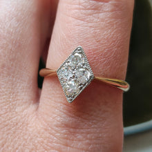 Load image into Gallery viewer, A rhombus shaped four stone diamond ring in yellow gold and platinum, modelled on a hand
