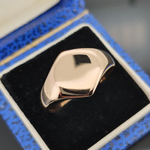 Load image into Gallery viewer, A gold hexagonal shaped signet ring, in a ring box
