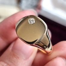 Load image into Gallery viewer, Vintage 9ct Gold Diamond Cushion Shaped Signet Ring in hand
