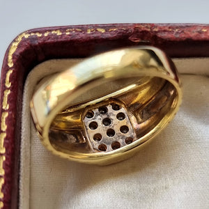 Gent's 18ct Yellow & White Gold Diamond Ring behind head
