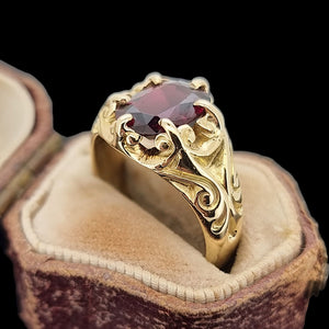 Antique 15ct Yellow Gold Garnet Solitaire Dress Ring in an antique ring box, on a black background 