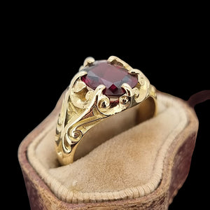 Antique 15ct Yellow Gold Garnet Solitaire Dress Ring in an antique ring box, on a black background
