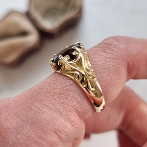 Antique 15ct Yellow Gold Garnet Solitaire Dress Ring modelled on an index finger