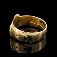 Load image into Gallery viewer, A yellow gold buckle band ring, on a black background
