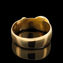 Load image into Gallery viewer, A yellow gold buckle band ring, on a black background
