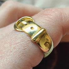 Load image into Gallery viewer, A yellow gold buckle band ring, modelled on a hand
