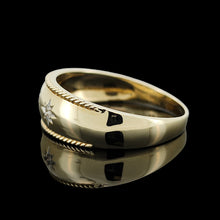 Load image into Gallery viewer, A three stone diamond star set gypsy ring in yellow gold, on a black background
