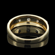 Load image into Gallery viewer, A three stone diamond star set gypsy ring in yellow gold, on a black background
