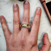 Load image into Gallery viewer, A three stone diamond star set gypsy ring in yellow gold, modelled on the middle finger of a hand
