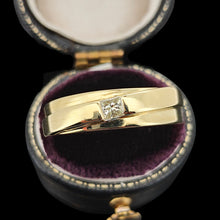 Load image into Gallery viewer, A yellow gold solitaire square cut diamond band, in a ring box, on a black background
