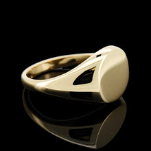 Load image into Gallery viewer, A yellow gold round signet ring, on a black background
