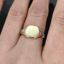 Load image into Gallery viewer, A yellow gold and platinum signet ring, modelled on a hand
