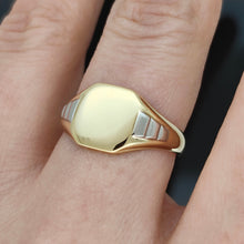 Load image into Gallery viewer, A yellow gold and platinum signet ring, modelled on a hand
