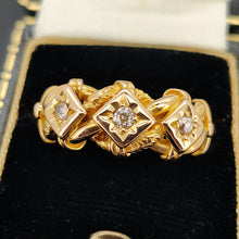 Load image into Gallery viewer, A yellow gold three stone diamond ring, in a ring box

