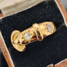 Load image into Gallery viewer, A yellow gold buckle band ring with two diamonds, in an antique ring box
