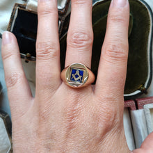 Load image into Gallery viewer, A yellow gold signet ring with an enamelled Masonic square, modelled on a hand
