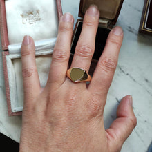 Load image into Gallery viewer, A yellow gold plain shield-shaped signet ring, modelled on a hand
