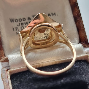 Vintage 14ct Gold Pale Citrine Ring behind head