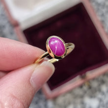 Load image into Gallery viewer, Vintage 18ct Gold Star Ruby Solitaire Ring in hand
