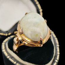 Load image into Gallery viewer, An oval, cabochon green agate dress ring in yellow gold, in a ring box
