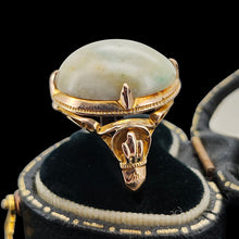 Load image into Gallery viewer, An oval, cabochon green agate dress ring in yellow gold, in a ring box
