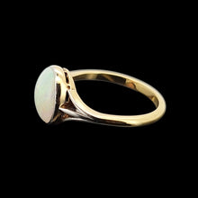 Load image into Gallery viewer, Gold ring with an opal gemstone on a black background
