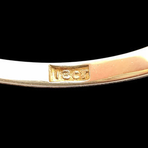 Close-up of an 18CT stamp inside a gold ring shank